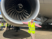 A Qantas Graduate at the hangar in front of a plane