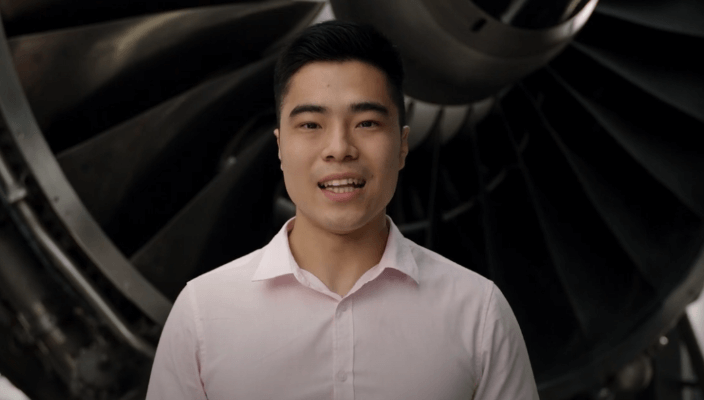 A graduate participating in an interview about their experience with the graduate program.