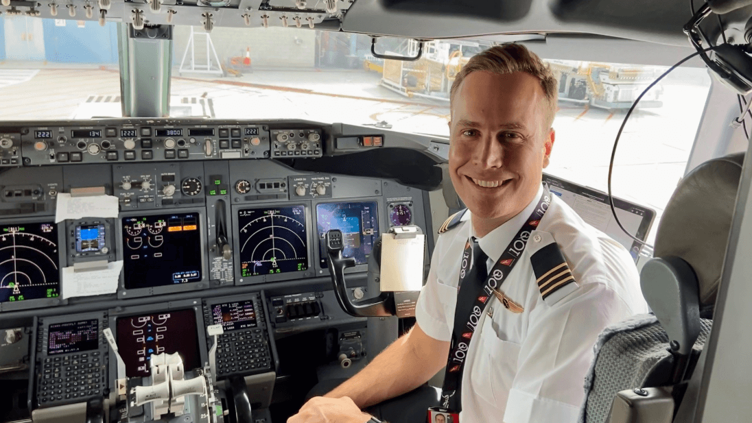 flight crew smiling as they leave the terminal