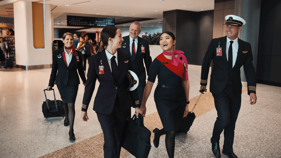 an image of staff smiling as they leave the terminal