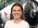 Qantas Corporate in front of jet engine smiling