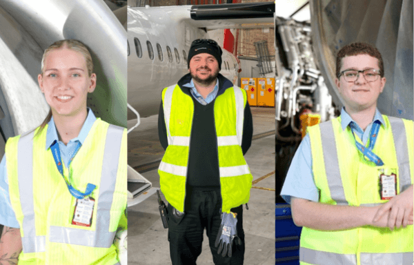 flight crew smiling as they leave the terminal