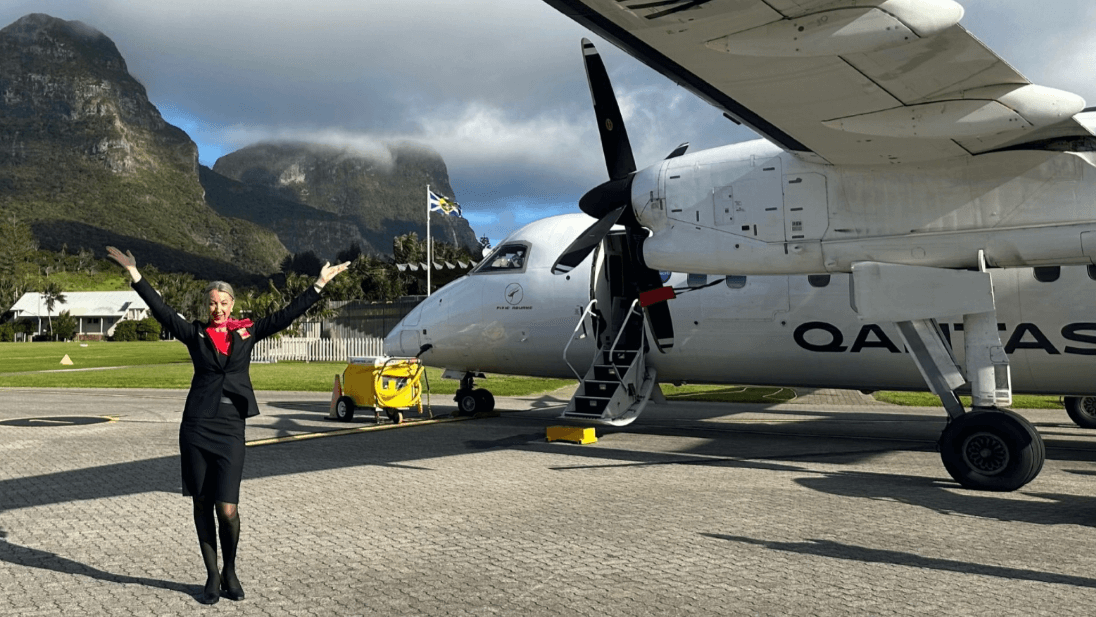 flight crew smiling as they leave the terminal