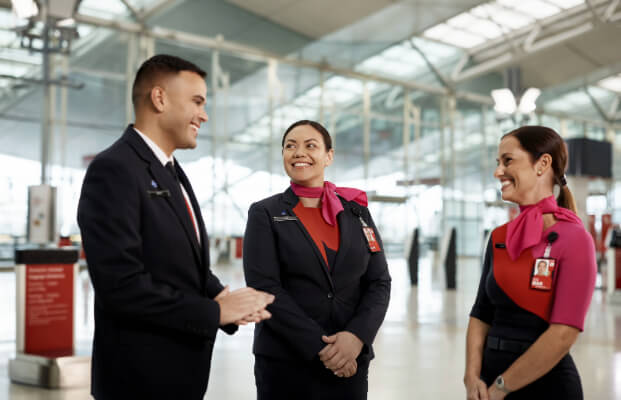 Members of Qantas Cabin Crew team laughing together