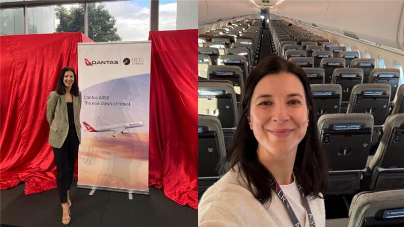 Qantas employee smiling at camera on board a Qantas aircraft