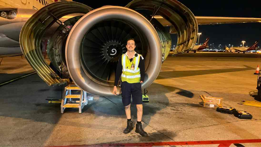 flight crew smiling as they leave the terminal