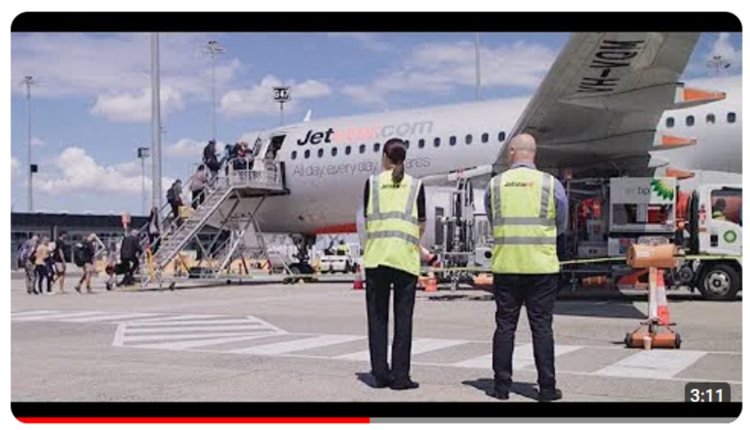 an image of staff smiling as they leave the terminal