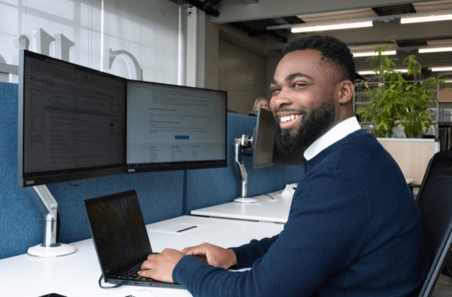 two colleagues having a conversation in a glass room