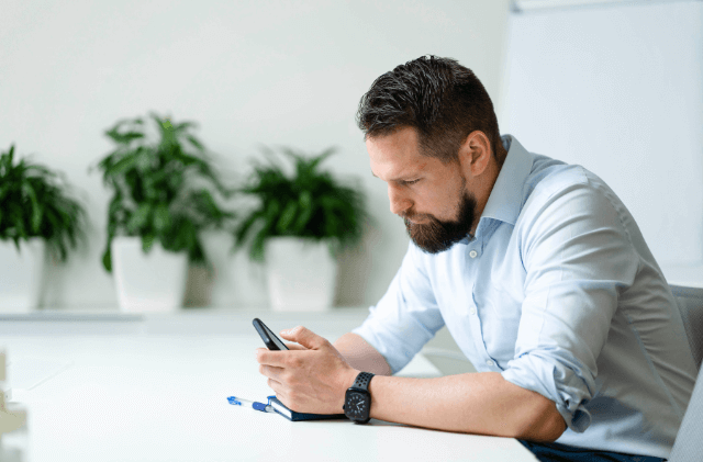 two colleagues having a conversation in a glass room
