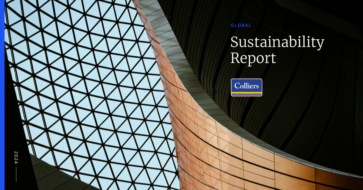 two colleagues having a conversation in a glass room