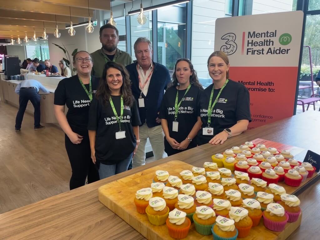 image of employees at a bake sale