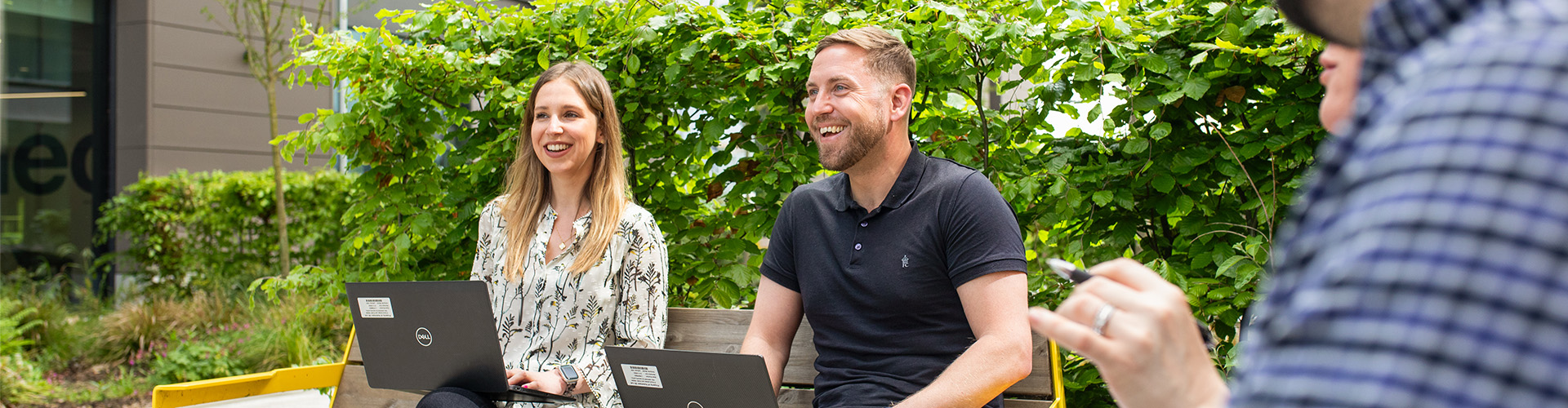 Image of  two people sitting on bench