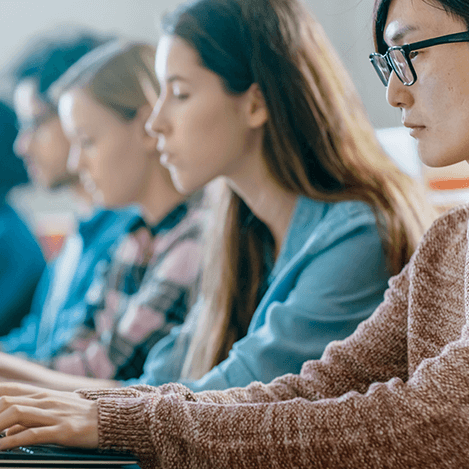 An image of people sitting looking at computers