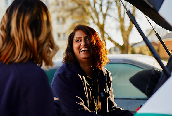 Photo of one of Specsavers Home Visits colleagues near a car