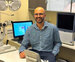 A man sitting in an optometry test room