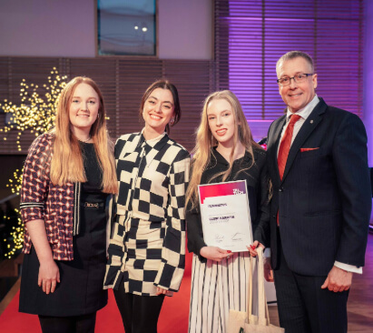 a woman staring at a computer screen