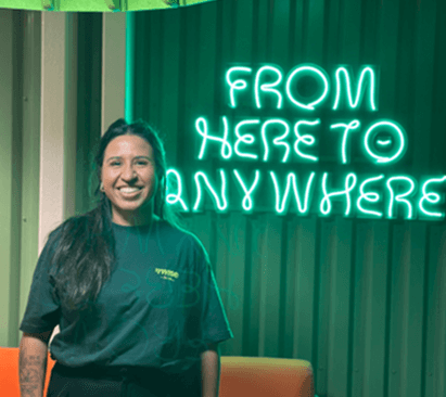 a woman staring at a computer screen