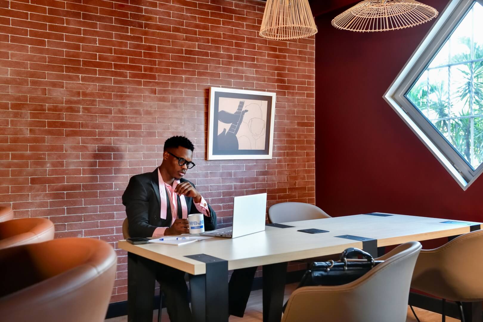 man sitting at desk working 