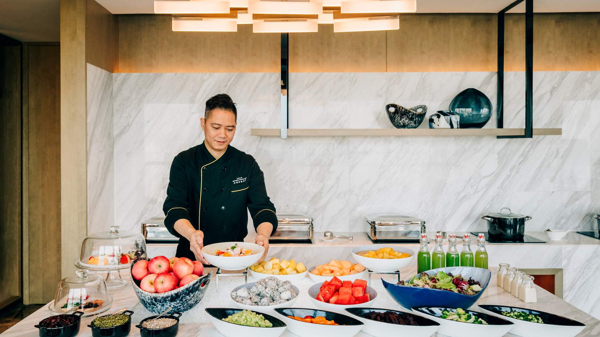 a chef prepping a breakfast spread 