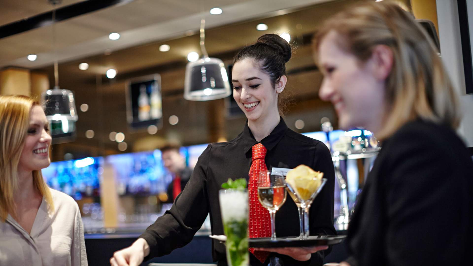 image of food and beverage server delivering drinks