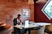 man sitting at desk working