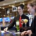 image of food and beverage server delivering drinks