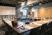 image of a meeting room with a laptop