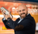 andrea di coppi - shaking up a drink in a shaker and smiling in a suit 