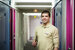 image of accor technician holding a spanner and smiling 