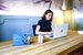 hr professional on call sitting at a desk with a laptop 