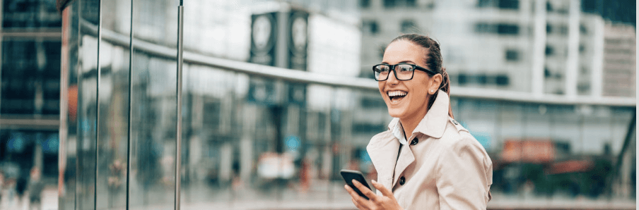 image of design professional sitting on steps with laptop and phone 