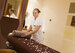 image of masseuse preparing bed at accor 