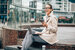 woman smiling sitting on step 