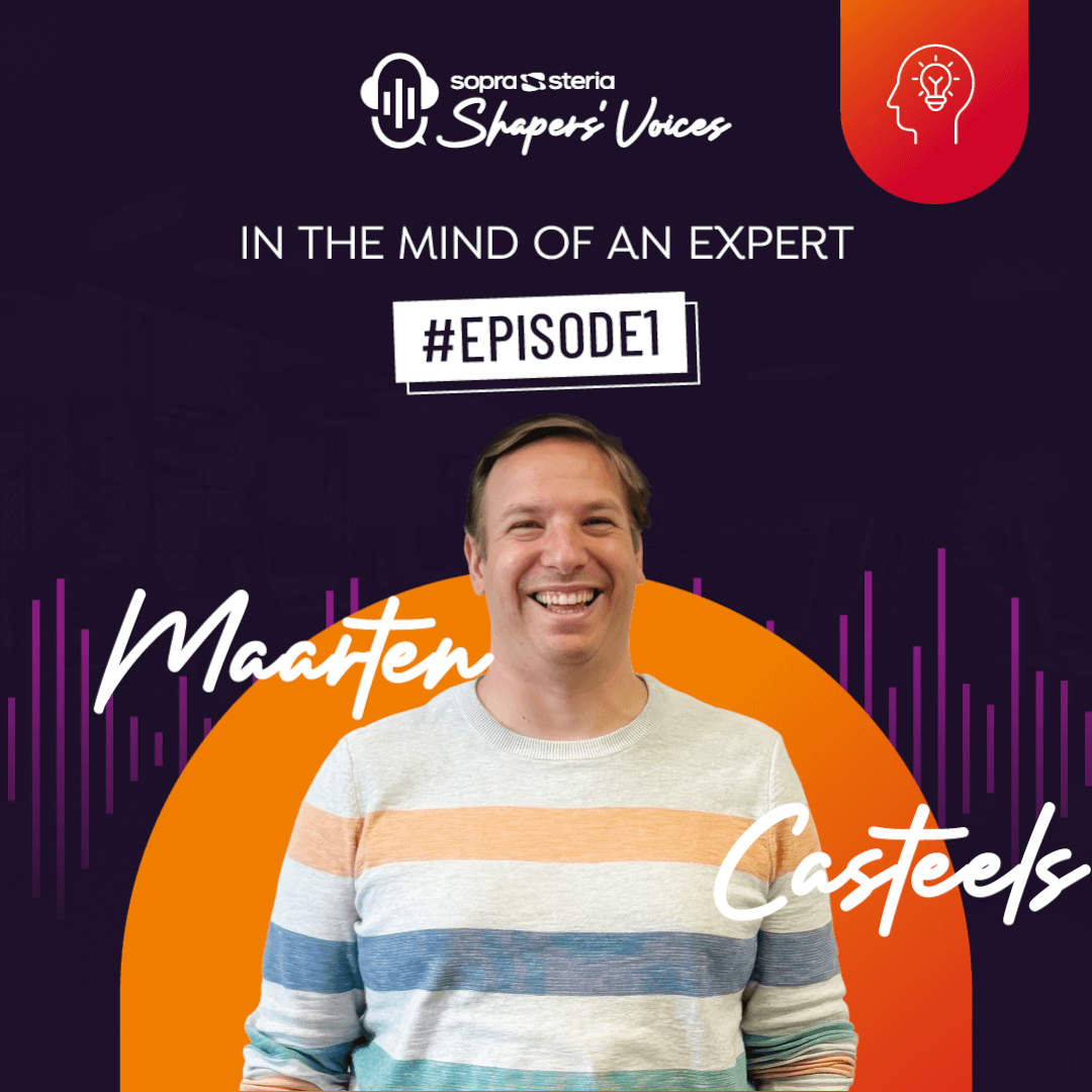 women sitting on a bed using a laptop