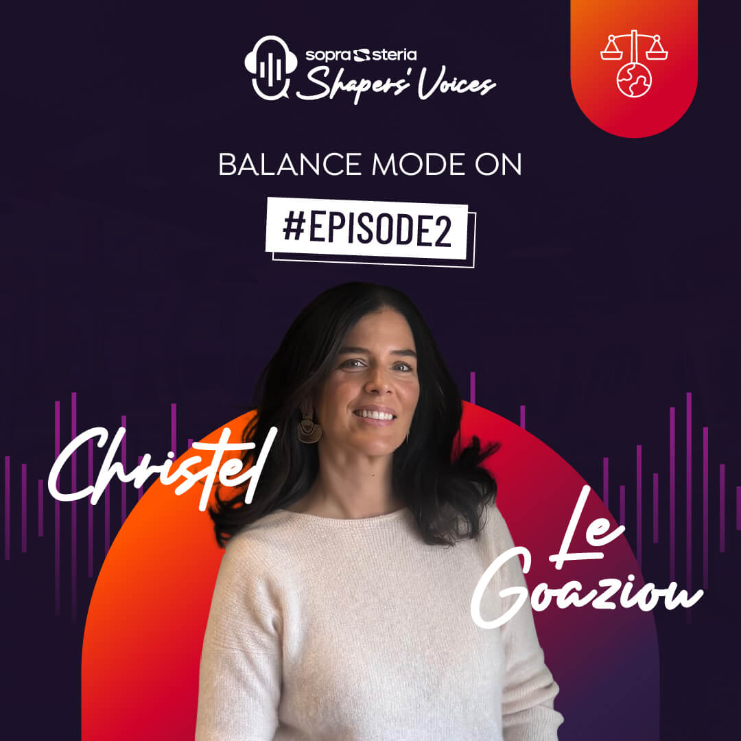 women sitting on a bed using a laptop