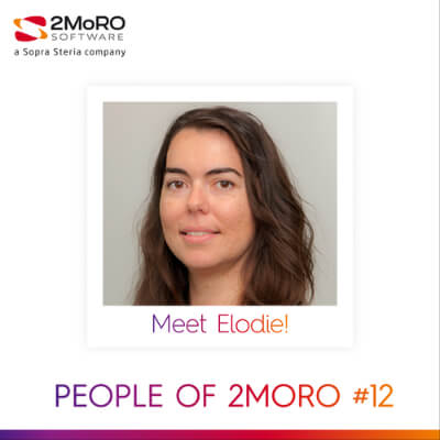 women sitting on a bed using a laptop