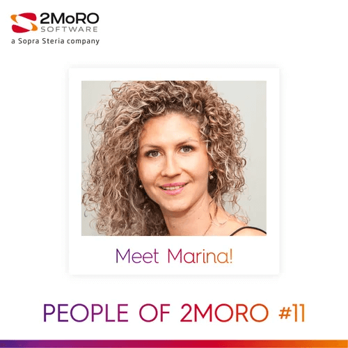 women sitting on a bed using a laptop