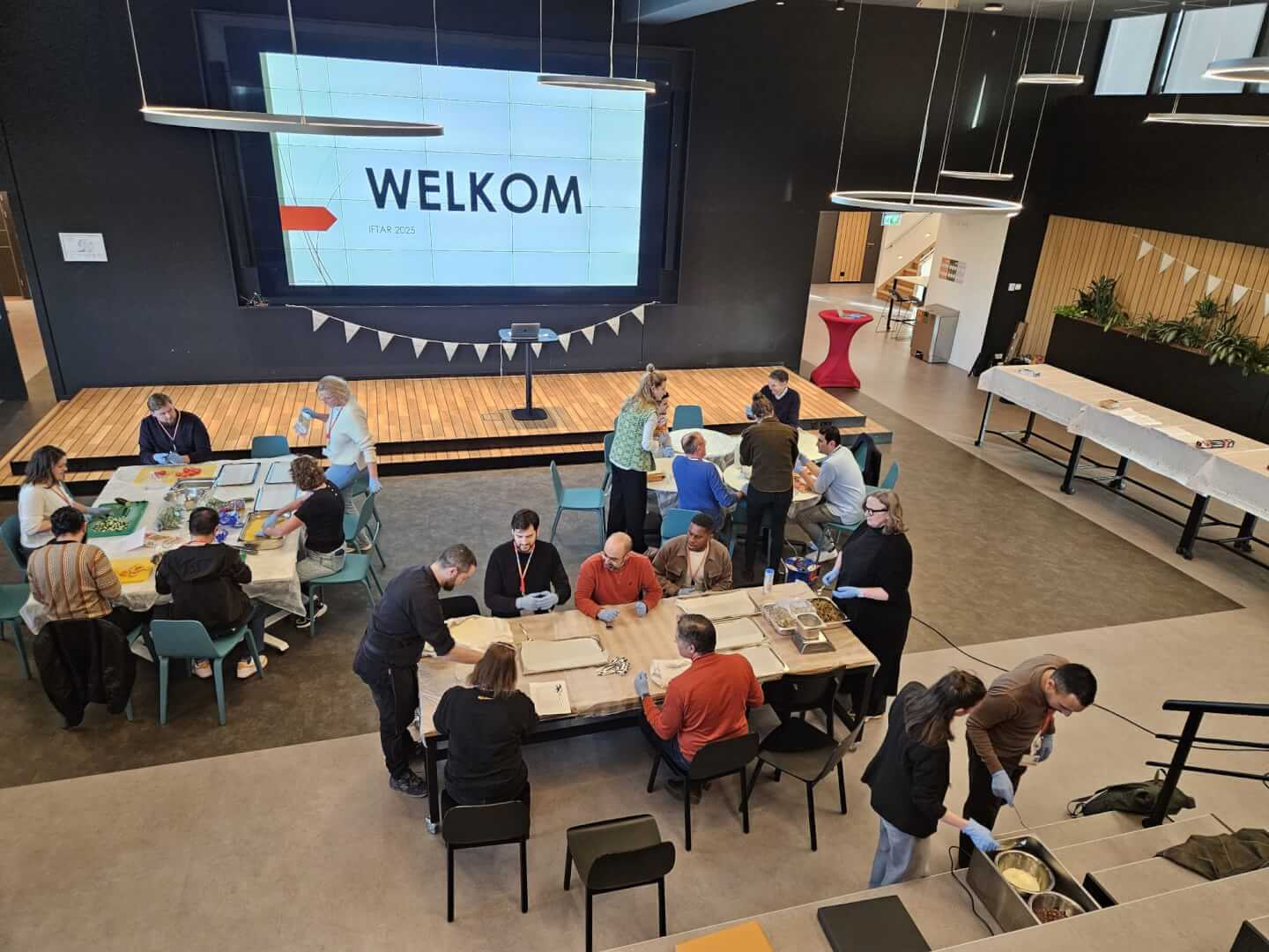 women sitting on a bed using a laptop