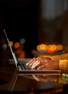 laptop on a wooden desk