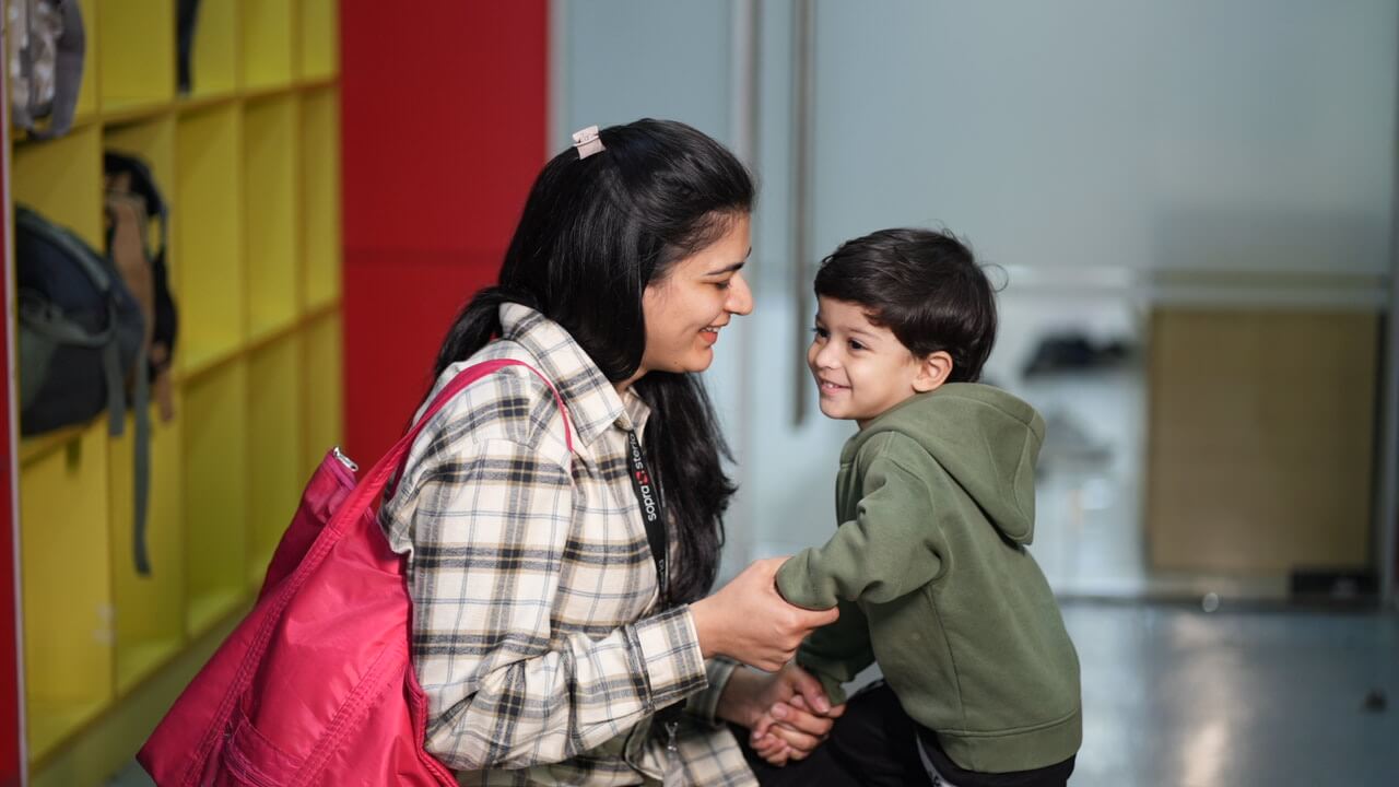 Laptop beside plant in vase