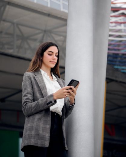 Laptop beside plant in vase