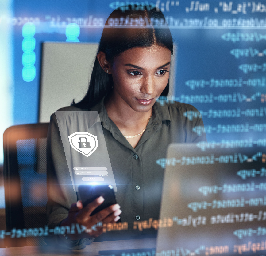 women sitting on a bed using a laptop