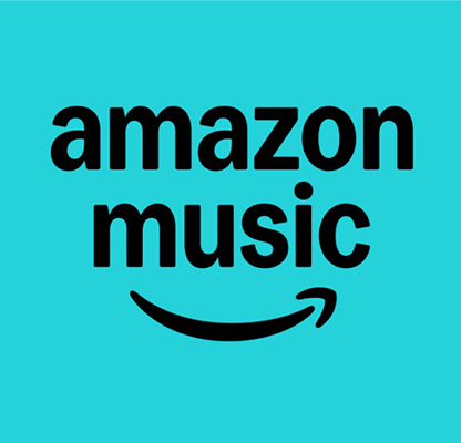 women sitting on a bed using a laptop