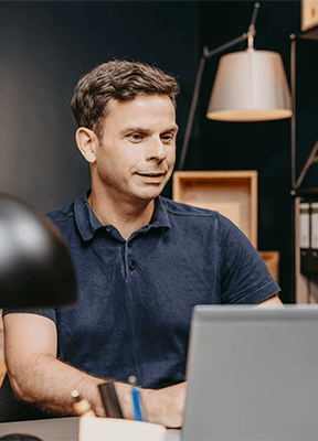 A man in front of his computer working in modern offices