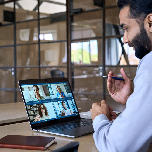 Man in an office on a zoom call