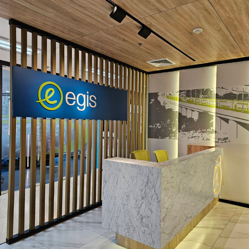 Picture of a desk with the EGIS logo behind