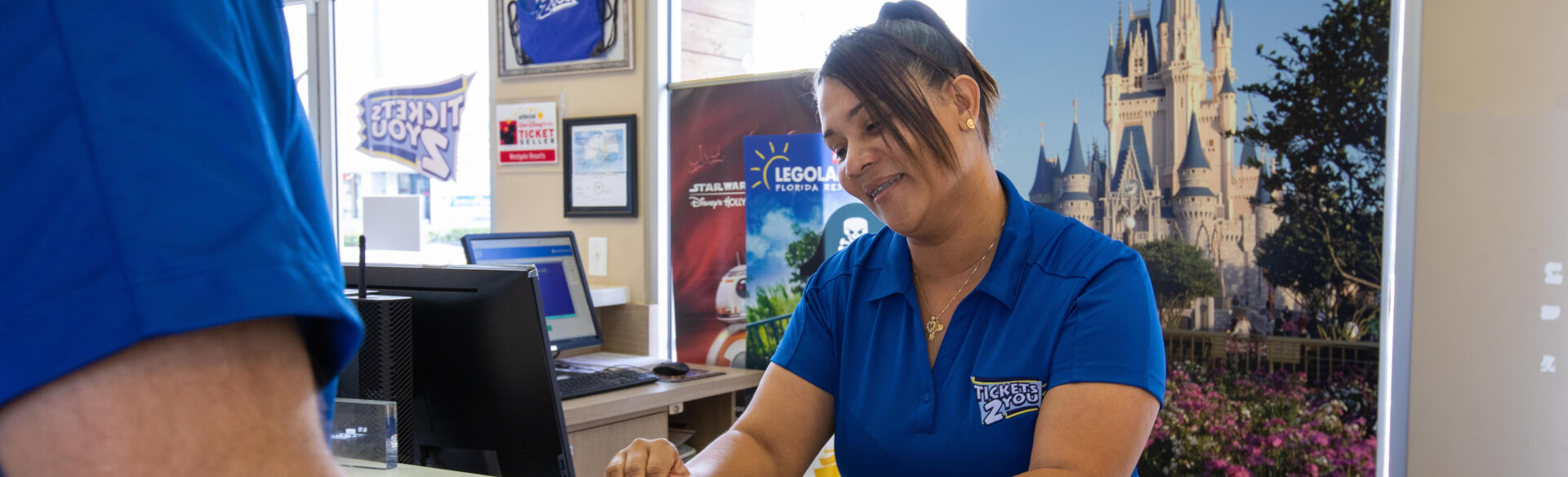 Smiling Westgate employee sat at a desk