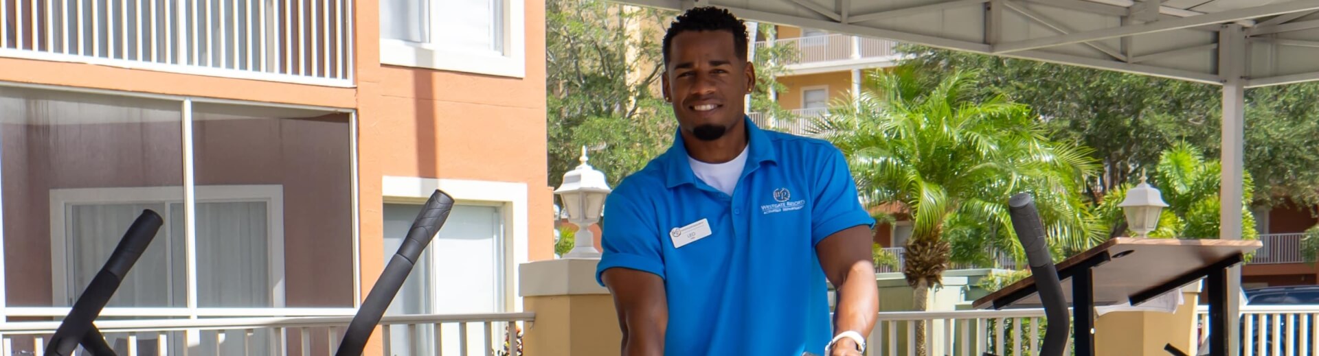 WG Activities Team Member stood smiling by a bike rack