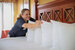 Housekeeper making a bed in a resort room