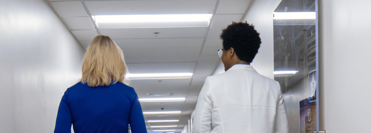 Two Westgate Corporate employees walking with their backs to the camera